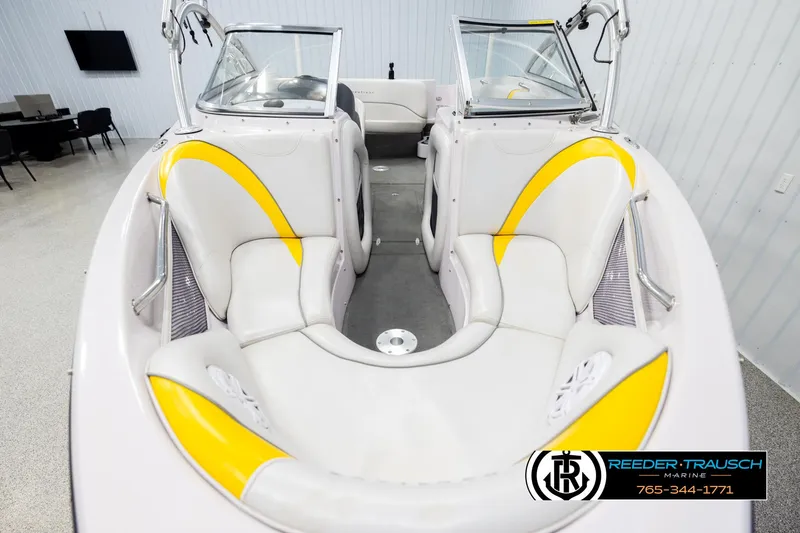 Slide: The Image of 2005 Correct Craft 226 Nautique boat interior with yellow and white seating. - 16