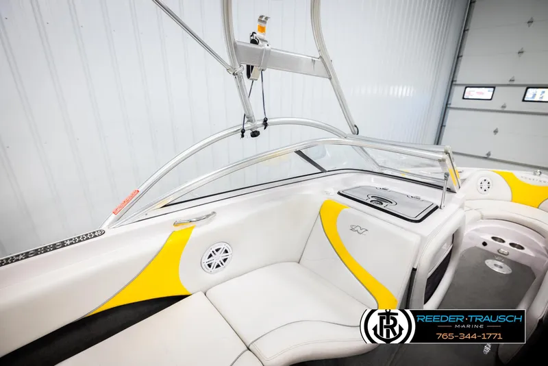 Slide: The Image of 2005 Correct Craft 226 Nautique boat interior with yellow accents and sleek design. - 22