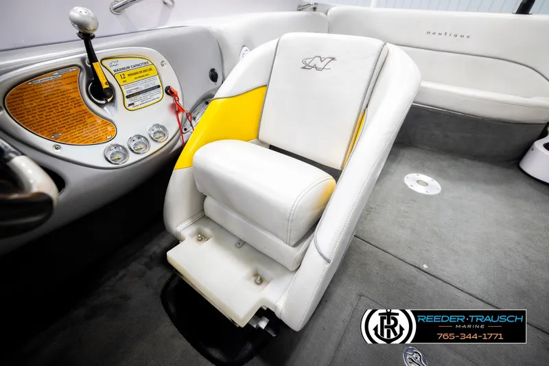 Slide: The Image of 2005 Correct Craft 226 Nautique boat interior with white and yellow seating. - 27
