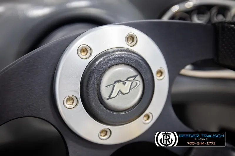 Slide: The Image of Close-up of 2005 Correct Craft 226 Natique steering wheel with logo. - 32