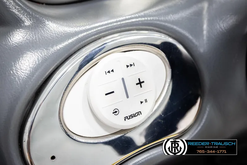 Slide: The Image of Close-up of a 2005 Correct Craft 226 Natique audio control panel. - 33