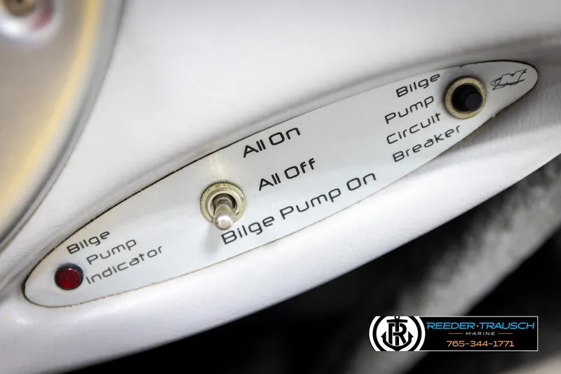 Slide: The Image of 2005 Correct Craft 226 Natique bilge pump controls with indicator and circuit breaker. - 39