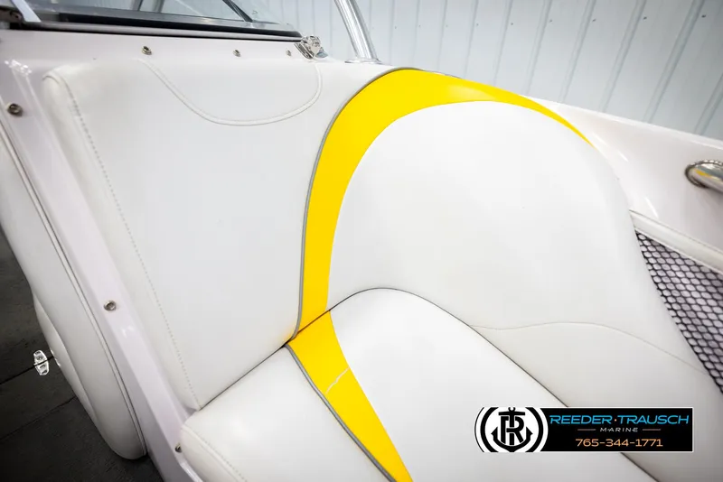Slide: The Image of 2005 Correct Craft 226 Natique boat seat with white and yellow upholstery. - 42