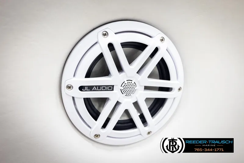 Slide: The Image of White JL Audio speaker on 2005 Correct Craft 226 Natique boat interior. - 44