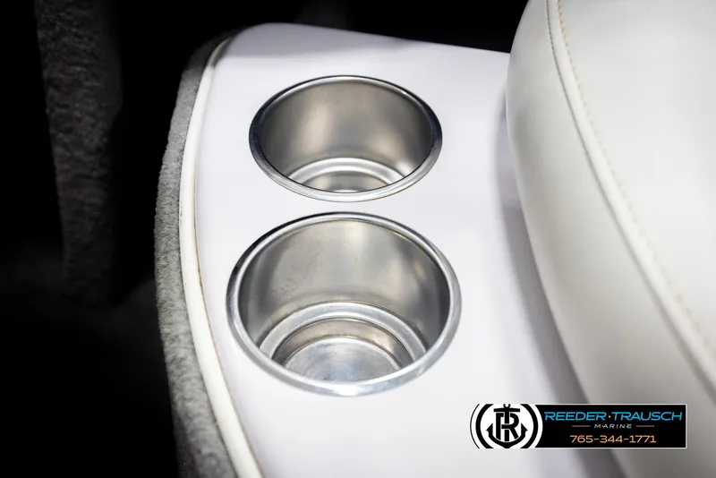 Slide: The Image of Cup holders in a 2005 Correct Craft 226 Nautique boat interior. - 46