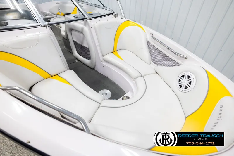 Slide: The Image of 2005 Correct Craft 226 Nautique boat interior with white and yellow seating. - 8
