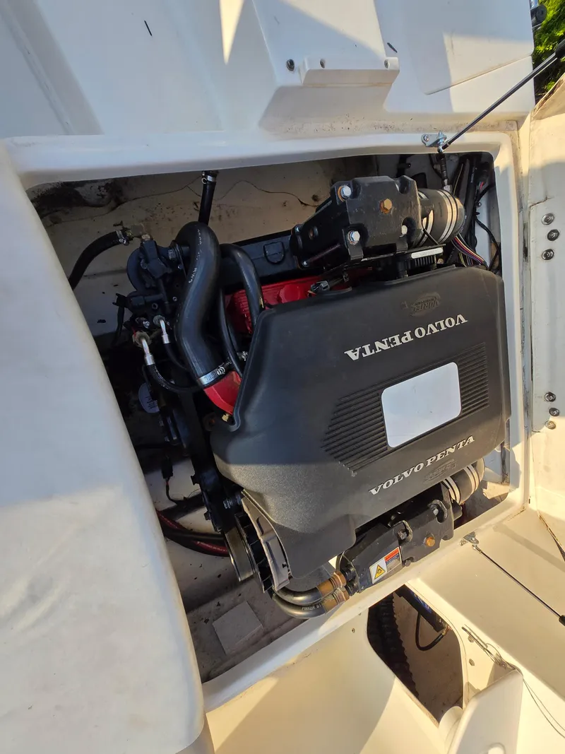 Slide: The Image of 2002 Glastron DX 215 boat engine compartment with Volvo Penta engine. - 7