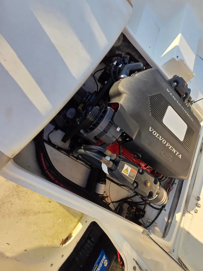 Slide: The Image of Engine compartment of a 2002 Glastron DX 215 boat with Volvo Penta engine. - 8