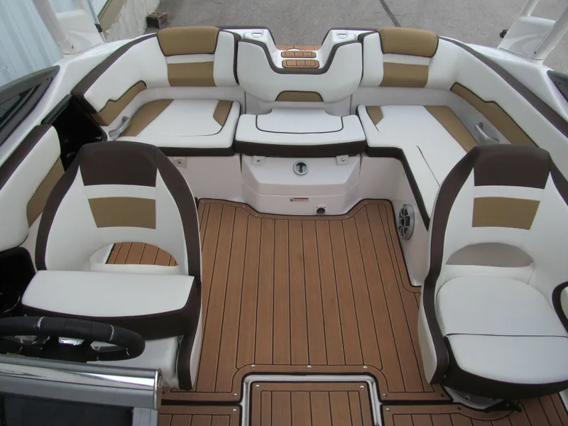 Slide: The Image of 2022 Yamaha Boats 195S interior with brown and white seating, teak-style flooring. - 11