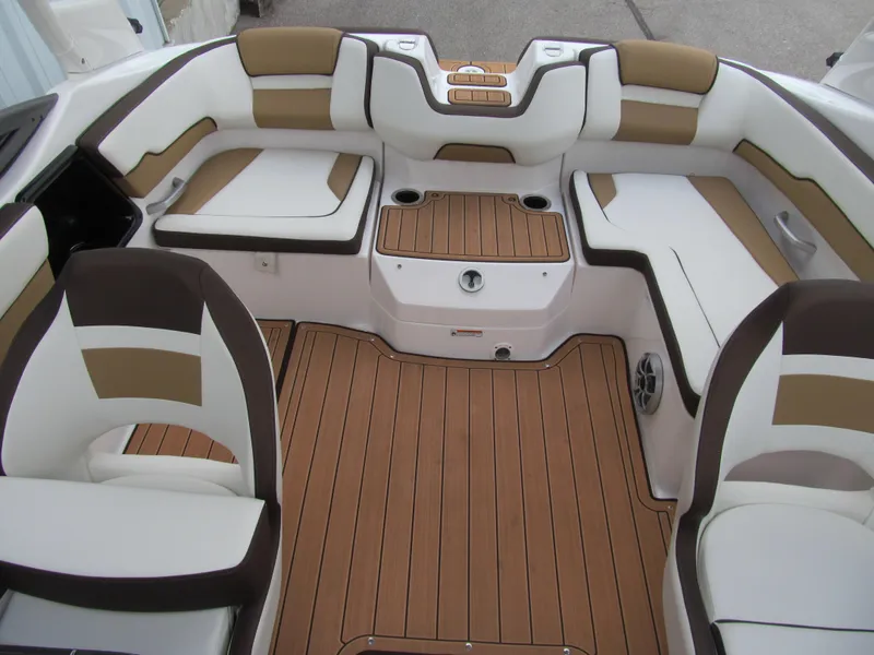 Slide: The Image of 2022 Yamaha Boats 195S interior with brown and white seating, teak-style flooring. - 12