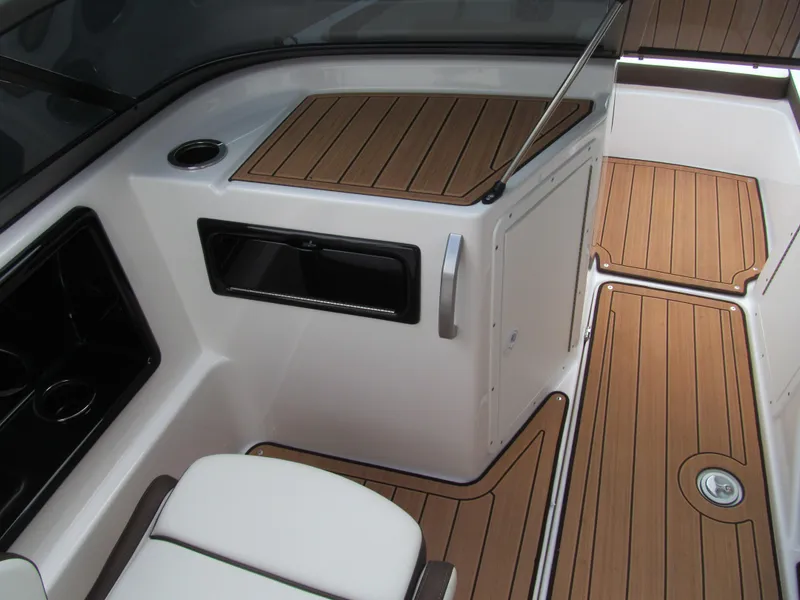 Slide: The Image of 2022 Yamaha Boats 195S interior with sleek wood finish and modern design. - 7