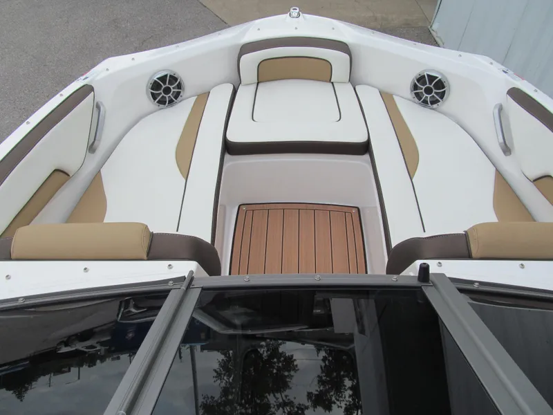 Slide: The Image of 2022 Yamaha Boats 195S interior with cushioned seating and wood accents. - 8