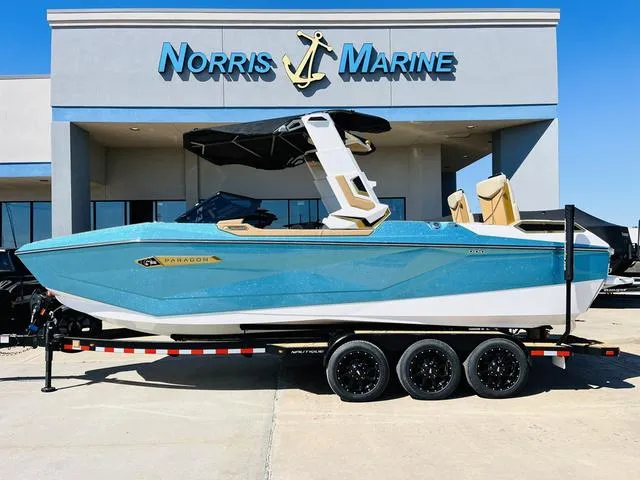 The Image of 2024 Nautique G25 Paragon boat in blue at Norris Marine dealership. - 1