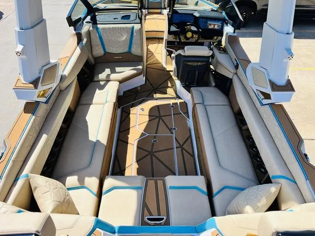 Slide: The Image of 2024 Nautique G25 Paragon boat interior with luxurious seating and modern design. - 11