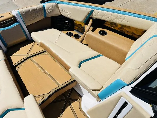 Slide: The Image of 2024 Nautique G25 Paragon interior with luxurious seating and modern design elements. - 14