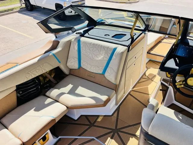 Slide: The Image of 2024 Nautique G25 Paragon interior with luxurious seating and modern design. - 17
