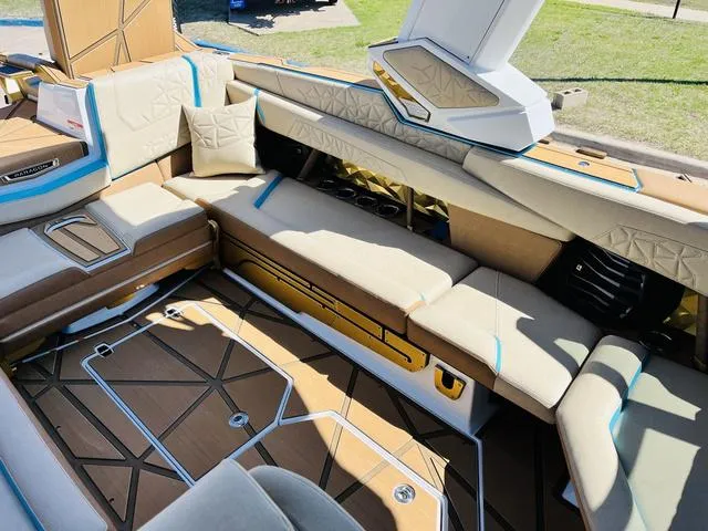 Slide: The Image of 2024 Nautique G25 Paragon interior with luxurious seating and modern design. - 18