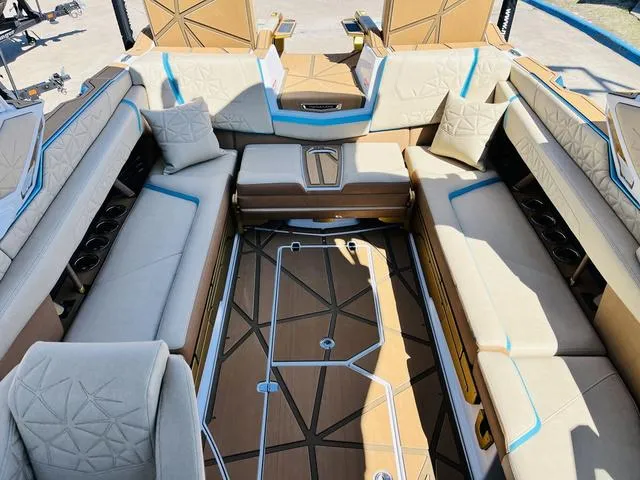 Slide: The Image of 2024 Nautique G25 Paragon interior with luxurious seating and modern design. - 19