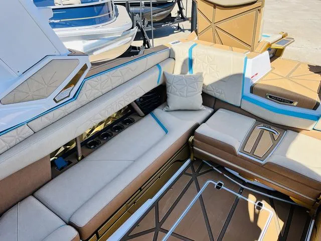 Slide: The Image of Luxurious interior of 2024 Nautique G25 Paragon boat with plush seating and modern design. - 20