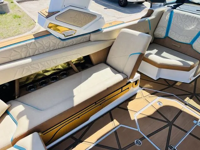 Slide: The Image of 2024 Nautique G25 Paragon interior with luxurious seating and modern design. - 24