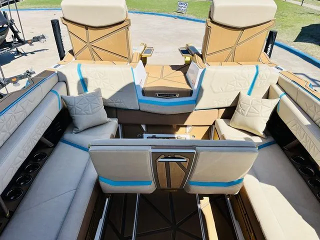 Slide: The Image of 2024 Nautique G25 Paragon boat interior with luxurious seating and modern design. - 29