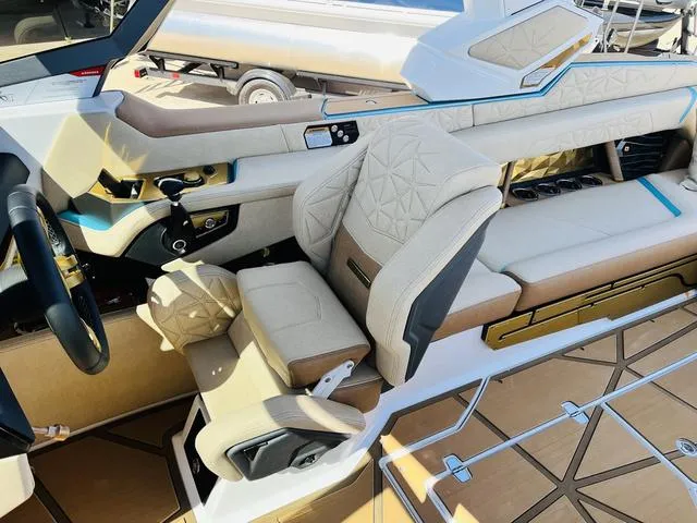 Slide: The Image of 2024 Nautique G25 Paragon interior with luxurious seating and modern design. - 36
