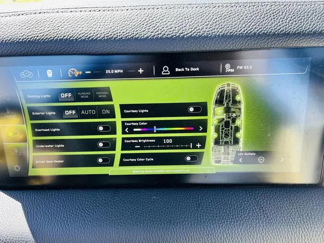 Slide: The Image of Touchscreen control panel of 2024 Nautique G25 Paragon boat, displaying lighting and settings options. - 40