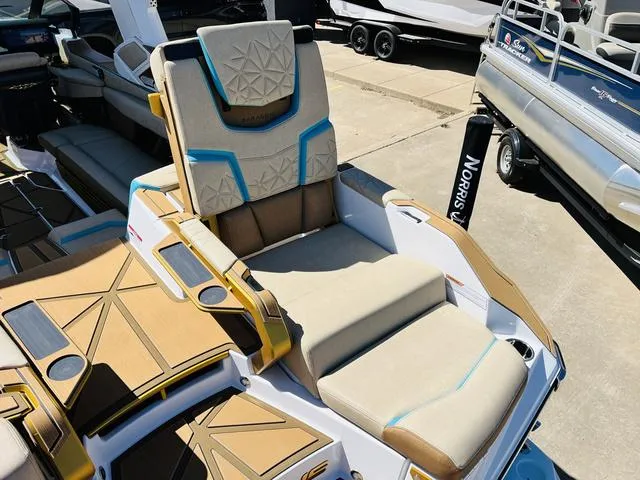 Slide: The Image of 2024 Nautique G25 Paragon boat interior with luxurious seating and modern design. - 48