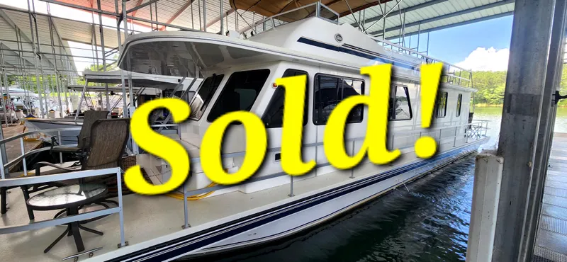 The Image of 2011 Gibson 50 Cabin Yacht docked, marked "Sold" in bold yellow text. - 0