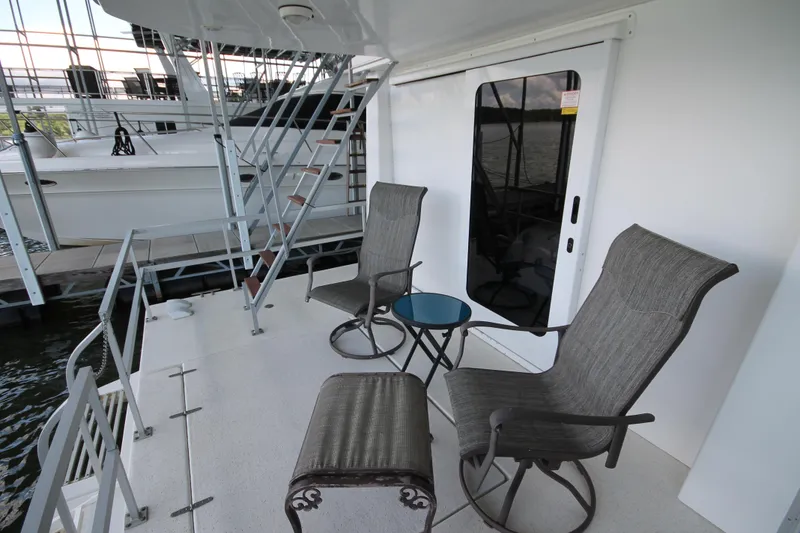 Slide: The Image of Outdoor seating area on 2011 Gibson 50 Cabin Yacht with chairs and table. - 10