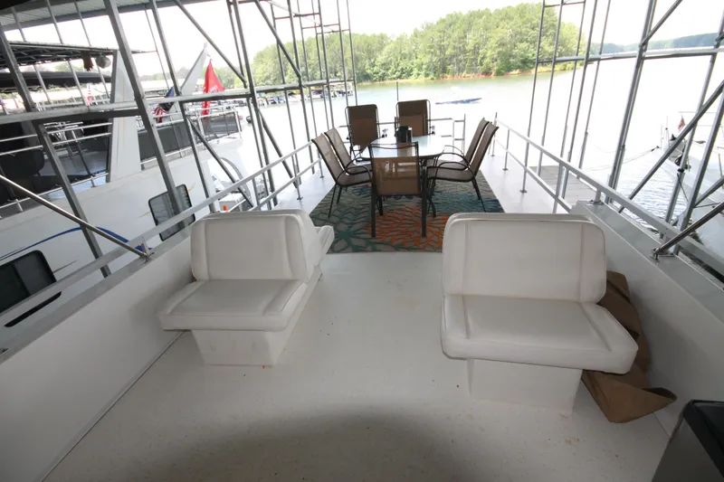 Slide: The Image of Spacious deck of 2011 Gibson 50 Cabin Yacht with seating and dining area. - 20