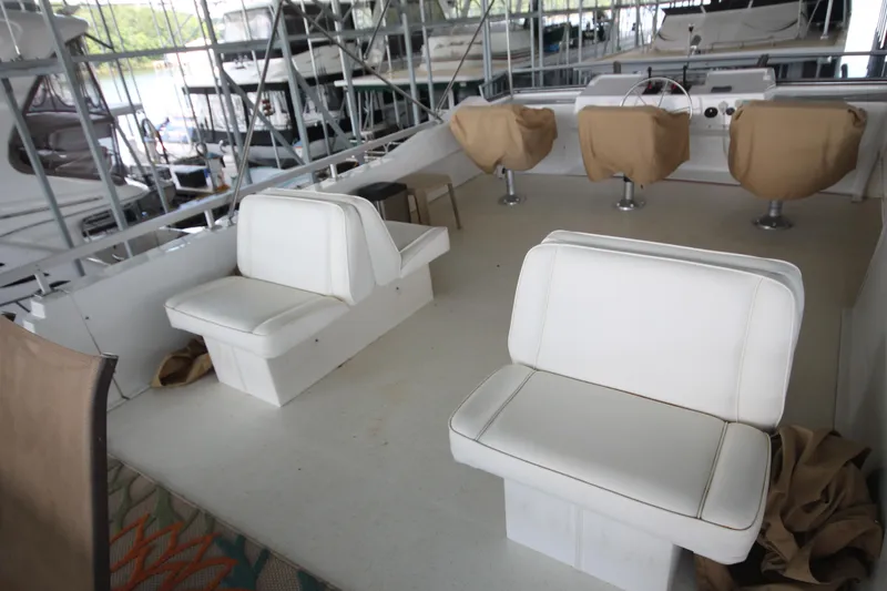 Slide: The Image of Interior of 2011 Gibson 50 Cabin Yacht with white seating and covered controls. - 21