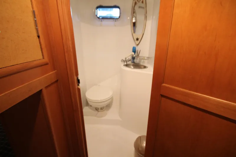 Slide: The Image of Bathroom interior of 2011 Gibson 50 Cabin Yacht with sink and toilet. - 28