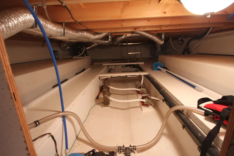 Slide: The Image of Engine room of 2011 Gibson 50 Cabin Yacht with visible pipes and equipment. - 30
