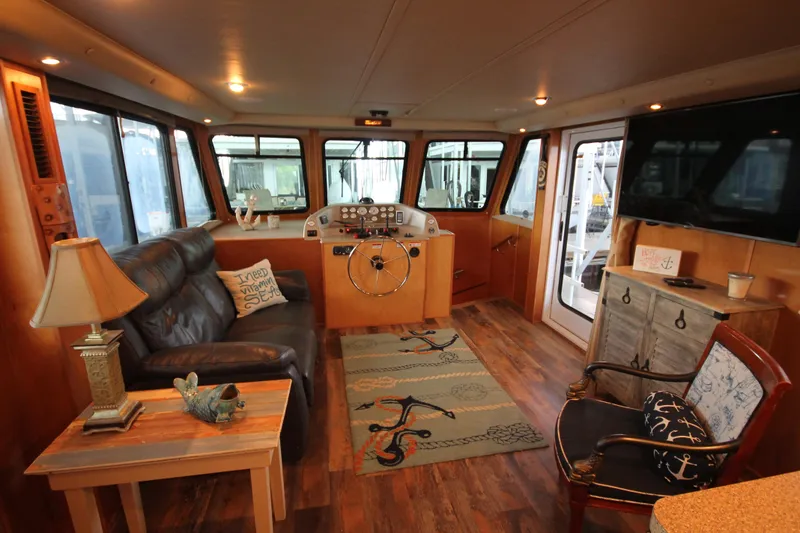 Slide: The Image of Interior of 2011 Gibson 50 Cabin Yacht with cozy seating and nautical decor. - 35