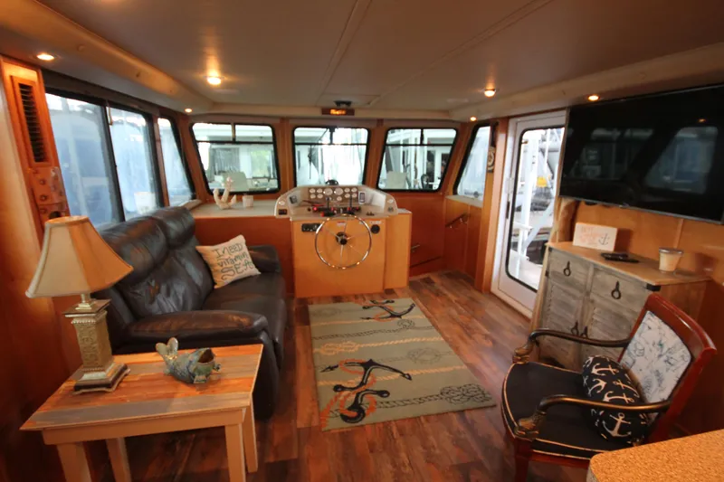Slide: The Image of Interior of 2011 Gibson 50 Cabin Yacht with cozy seating and nautical decor. - 37