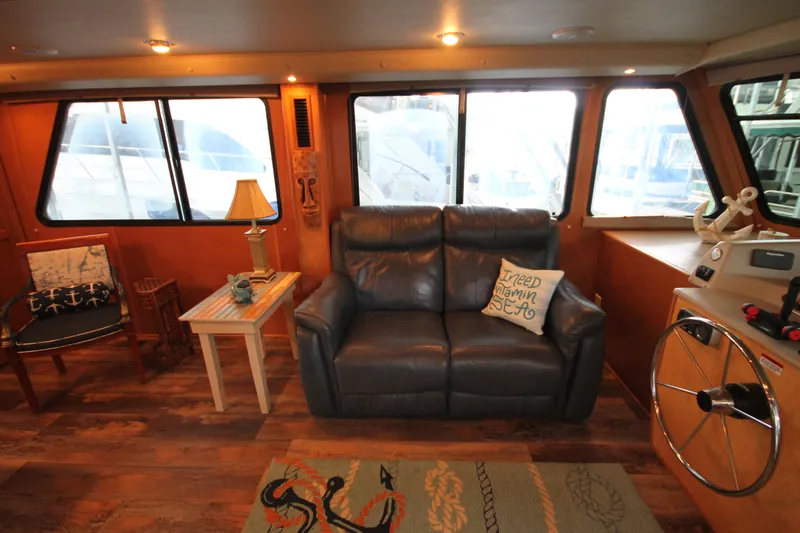 Slide: The Image of Interior of 2011 Gibson 50 Cabin Yacht with cozy seating and nautical decor. - 41