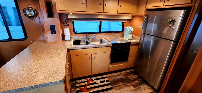 Slide: The Image of Modern kitchen in a 2011 Gibson 50 Cabin Yacht with stainless steel appliances. - 47