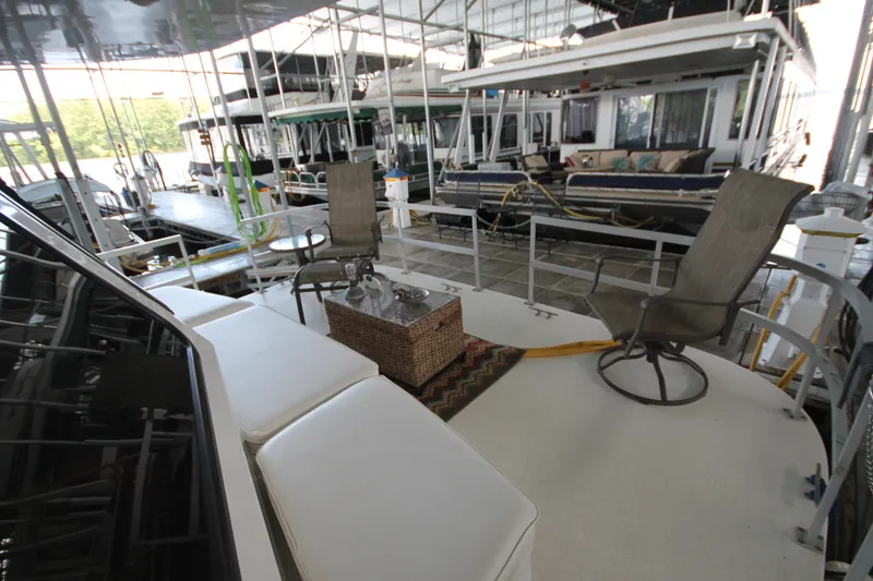 Slide: The Image of Luxurious 2011 Gibson 50 Cabin Yacht with outdoor seating and marina view. - 8