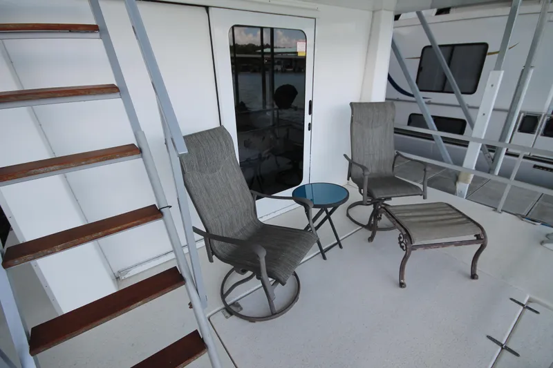 Slide: The Image of Outdoor seating area on 2011 Gibson 50 Cabin Yacht with chairs and table. - 9