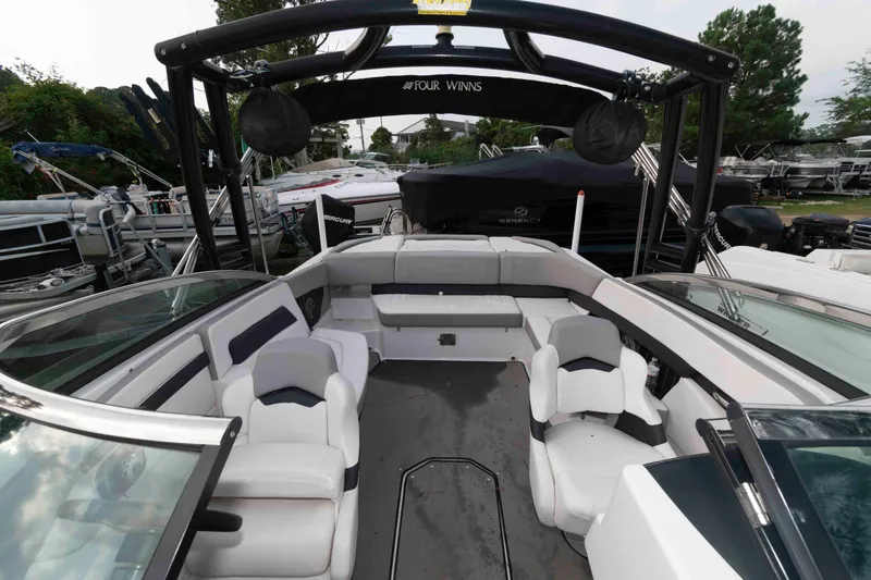 Slide: The Image of 2017 Four Winns H260 boat interior with spacious seating and sleek design. - 12
