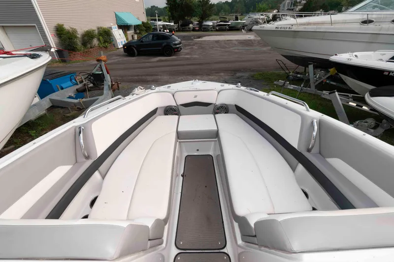 Slide: The Image of 2017 Four Winns H260 boat interior with white seating and outdoor setting. - 8