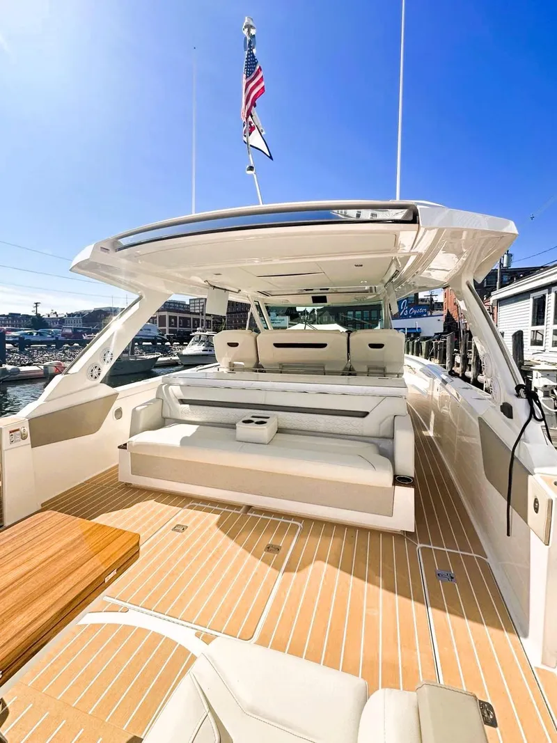 Slide: The Image of 2024 Tiara Yachts 43 LS luxury yacht with spacious deck and seating area. - 7