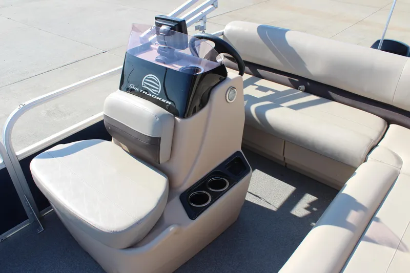 Slide: The Image of 2019 Sun Tracker Bass Buggy 16 XL Select boat interior with beige seating and steering console. - 11