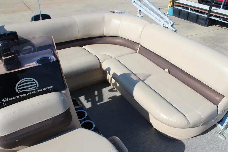Slide: The Image of 2019 Sun Tracker Bass Buggy 16 XL Select pontoon boat interior with beige seating. - 12