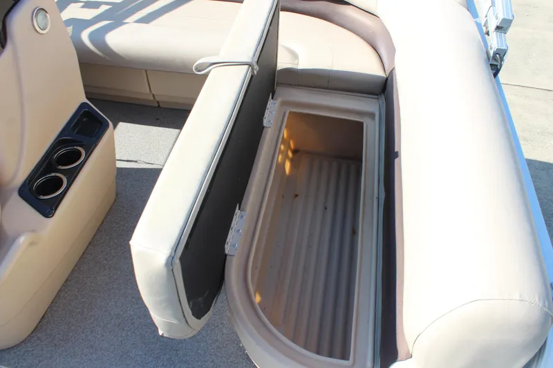 Slide: The Image of 2019 Sun Tracker Bass Buggy 16 XL Select boat seat storage compartment open. - 13