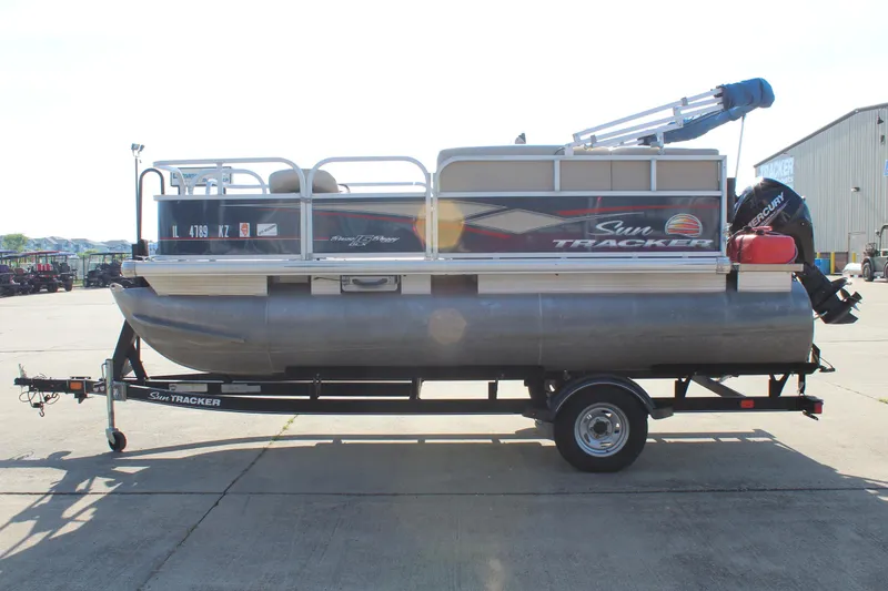 Slide: The Image of 2019 Sun Tracker Bass Buggy 16 XL Select pontoon boat on trailer. - 4
