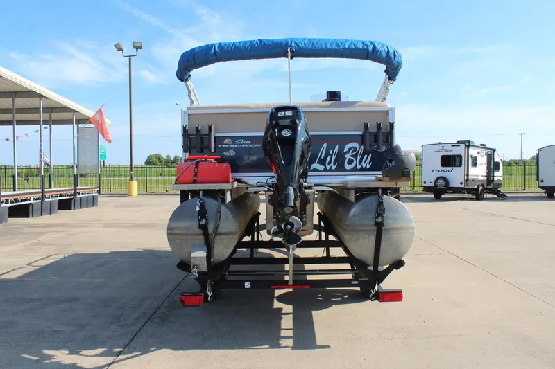 Slide: The Image of 2019 Sun Tracker Bass Buggy 16 XL Select pontoon boat on trailer, rear view. - 6