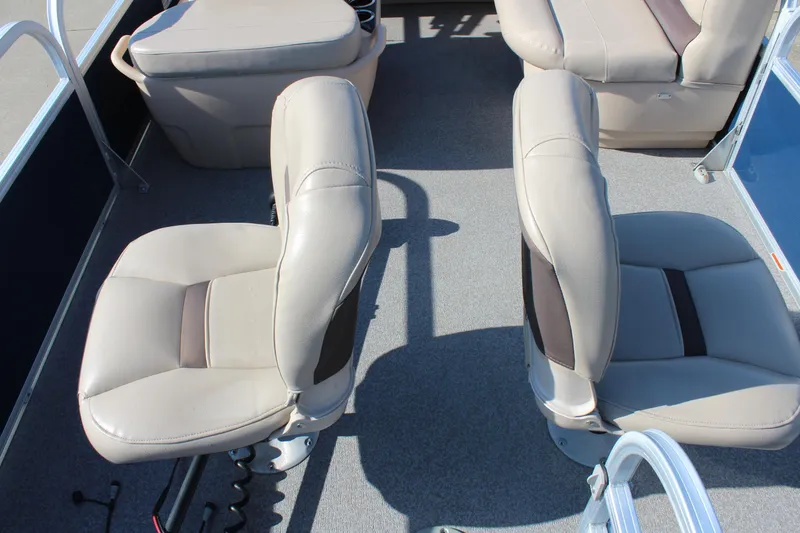 Slide: The Image of 2019 Sun Tracker Bass Buggy 16 XL Select interior with beige seating and carpeted floor. - 8