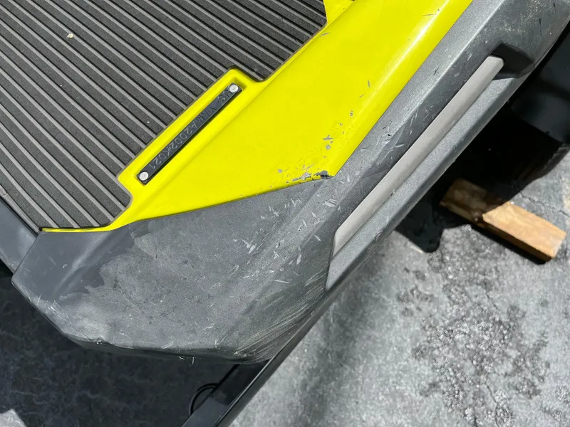 Slide: The Image of Close-up of 2021 Yamaha WaveRunner VX Cruiser HO with visible scratches on yellow and gray surface. - 10